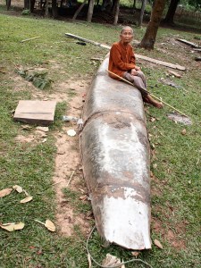Old lady sitting on fuel dump missile